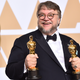 Guillermo del Toro with his 2018 Best Picture and Best Director Oscars for The Shape of Water.